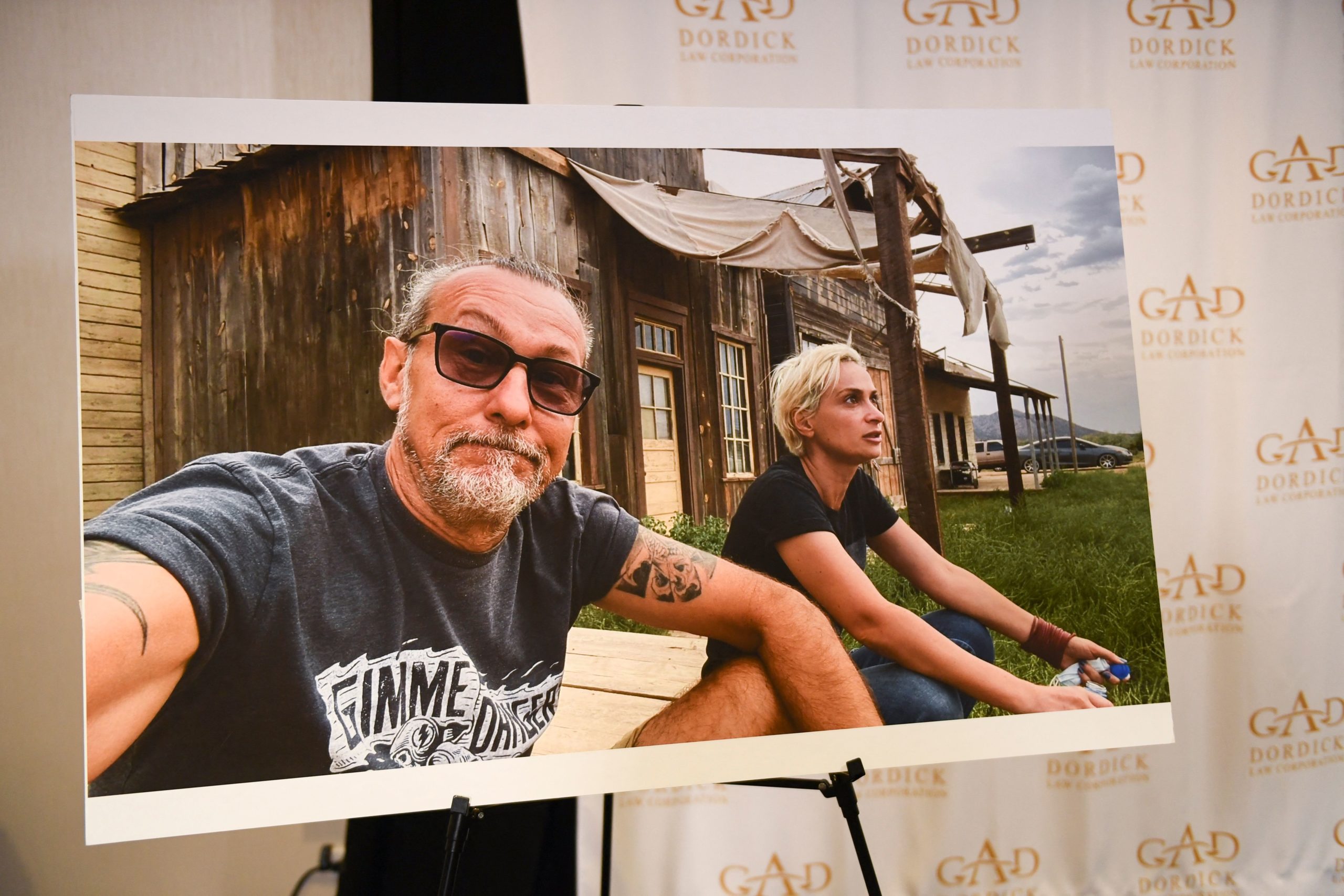 A photo of Serge Svetnoy and Halyna Hutchins is displayed after a press conference with attorney Gary Dordick (not pictured) and Serge Svetnoy, chief lighting technician for the film Rust, about a lawsuit filed after the fatal shooting on the film Rust during a press conference on November 10, 2021 in Los Angeles, California. - US actor Alec Baldwin is being sued by a