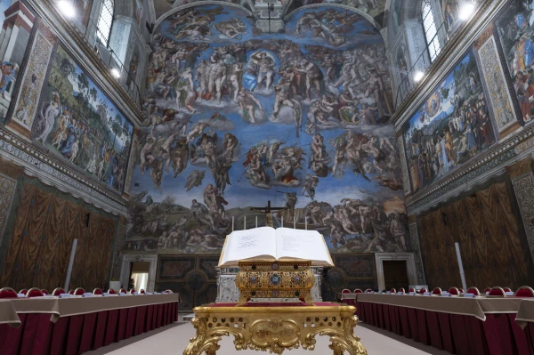 The Book of the Gospels is displayed at the Sistine Chapel for the conclave to elect the next pope, Tuesday, May 6, 2025. Credit: Vatican Media