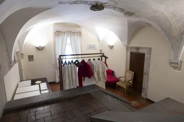 Vestments rest in the Room of Tears at the Sistine Chapel ahead of the conclave to elect the next pope, Tuesday, May 6, 2025. Credit: Vatican Media