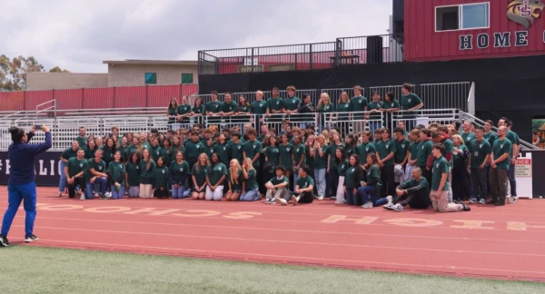 Students pose after being called to