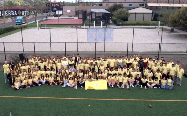 Students pose after being called to