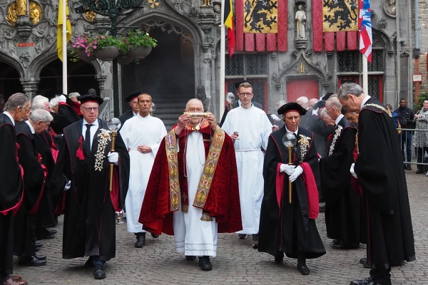 The vial containing the cloth with the Holy Blood is carried from the basilica by the brotherhood after morning Mass. May 28, 2025. Credit: Thomas P. Reiter