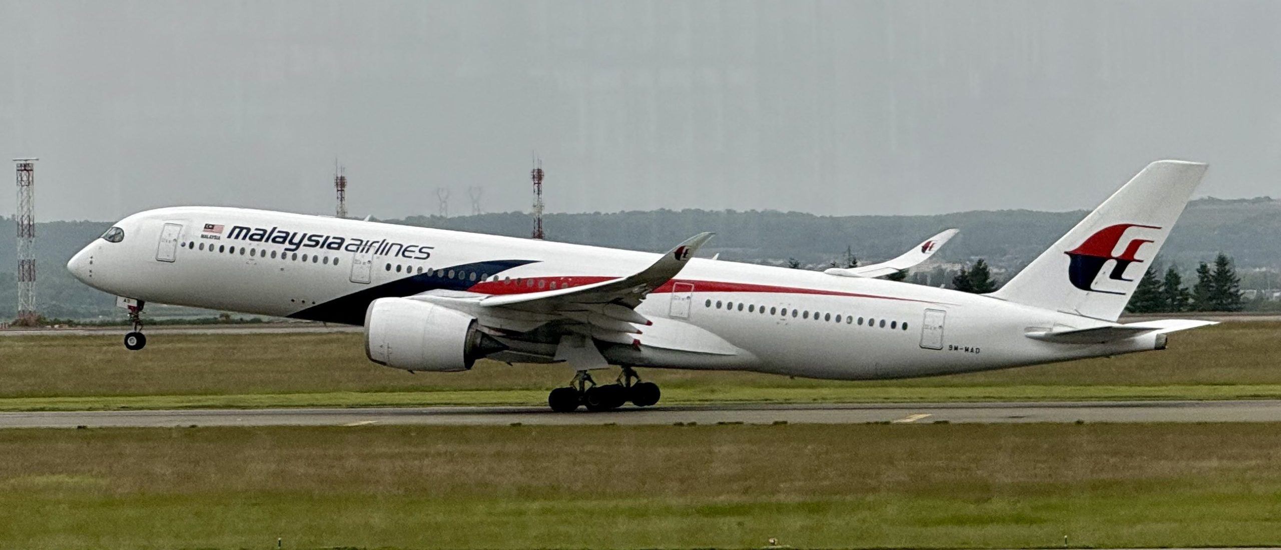 A Malaysia Airlines Boeing 777 takes of from Paris Roissy Charles De Gaulle (CDG) airport on May 17, 2025. (Photo by DANIEL SLIM/AFP via Getty Images)