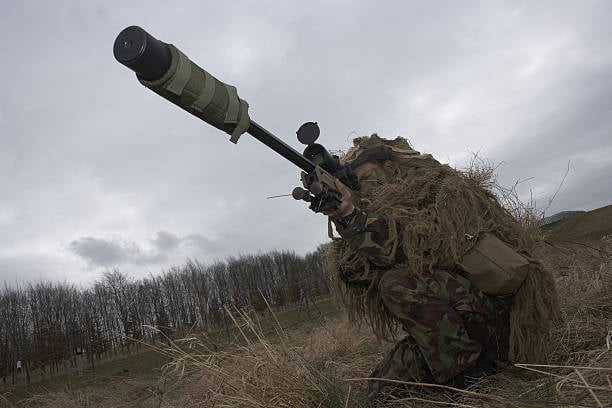 A suppressed weapon. (Photo by In Pictures Ltd./Corbis via Getty Images)
