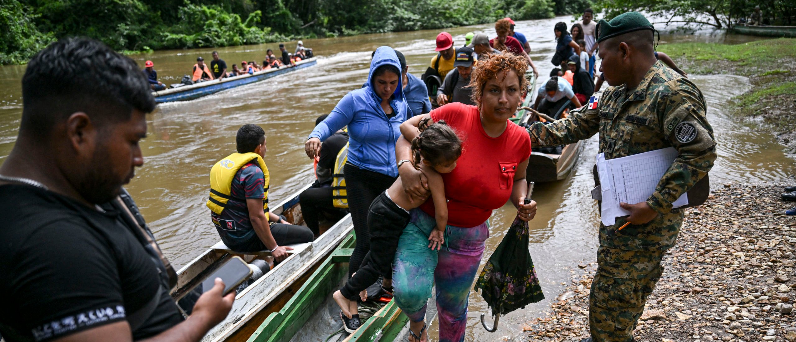 Migrants arrive at the Reception Center for Migrant Care in Lajas Blancas, in the jungle province of Darien, Panama, on June 28, 2024. (Photo by MARTIN BERNETTI/AFP via Getty Images)