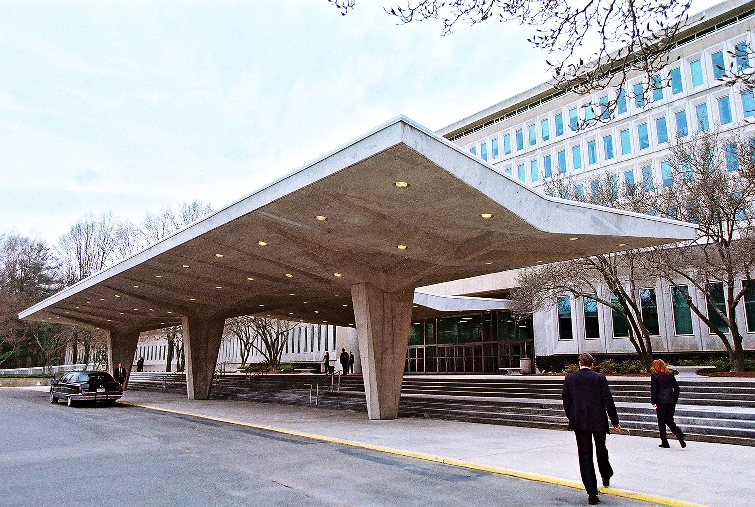 Employees of the Central Intelligence Agency walk in front of the Agency''s facility March 20, 2001 in Langley, Virginia. (Pool Photo by David Burnett/Getty Images)