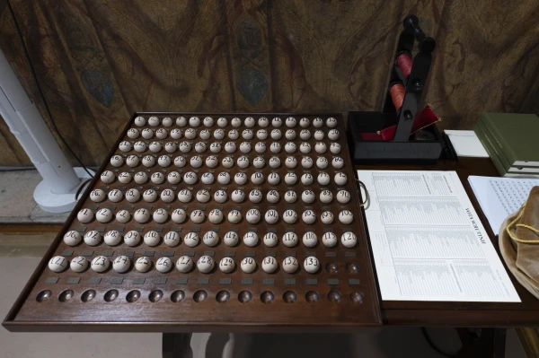 Wooden spheres are inscribed with numbers corresponding to cardinal electors, a means of drawing lots to select scrutineers, revisers, and infirmarii prior to the conclave to elect the next pope, Tuesday, May 6, 2025. Credit: Vatican Media