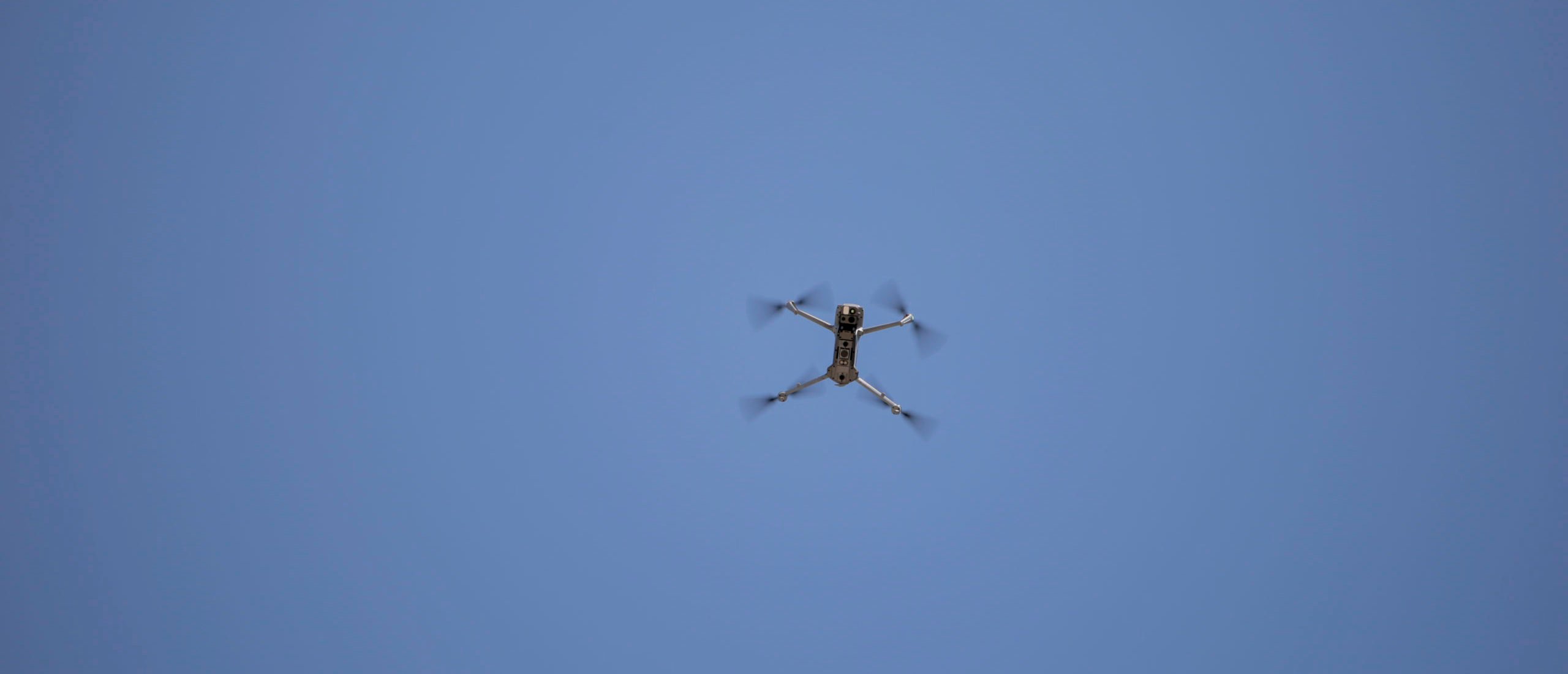 An Israeli army drone hovers in the air as Israeli forces continue to raid the town of Arraba, south of Jenin in the northern West Bank, on March 12, 2025 carrying out a large-scale operation involving house raids on Palestinian citizens. The army is also arresting young men and taking them to an area that has been turned into an interrogation center. (Photo by MOJAHID NAW/Middle East Images/AFP via Getty Images)