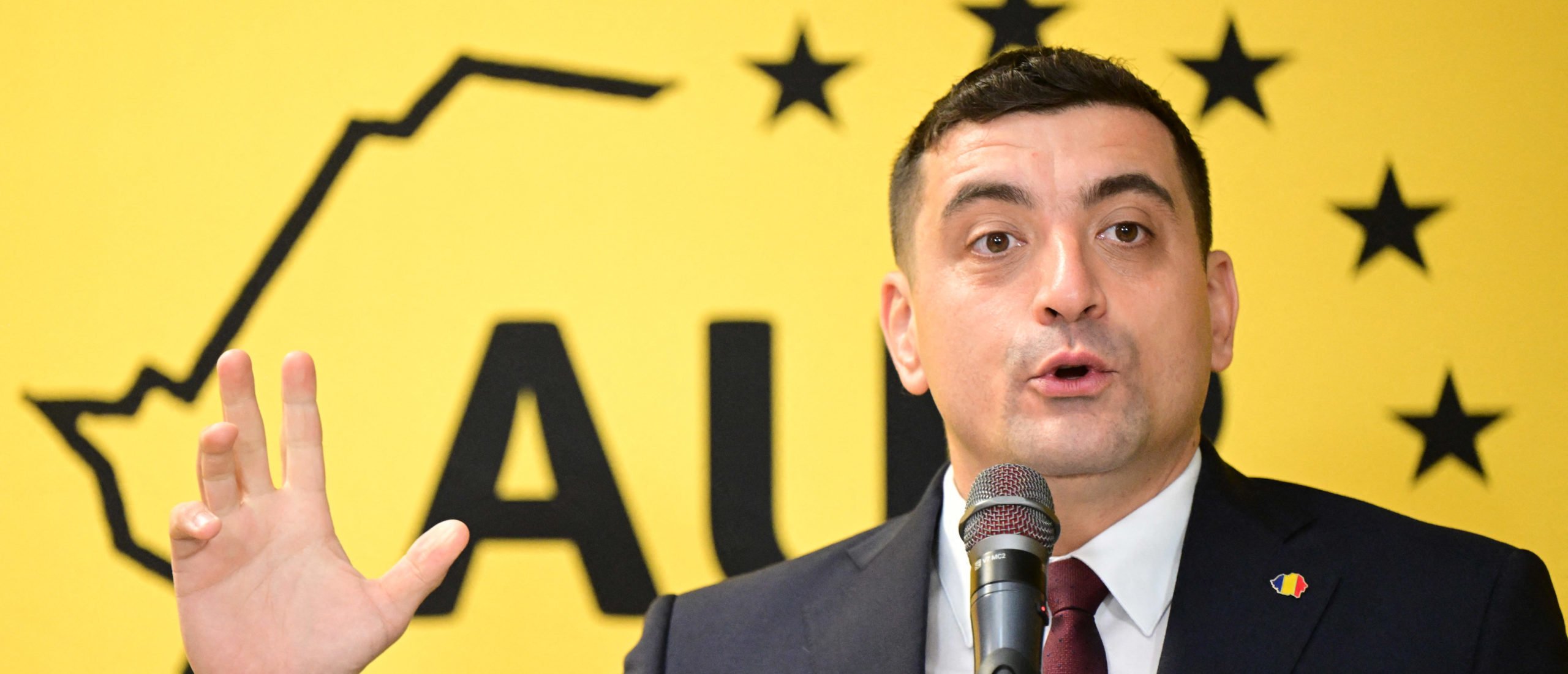 George Simion, leader of Romania's far-right AUR party, addresses a press conference held for the foreign media at the party's headquarters in Bucharest, Romania, on December 3, 2024. (Photo by DANIEL MIHAILESCU/AFP via Getty Images)