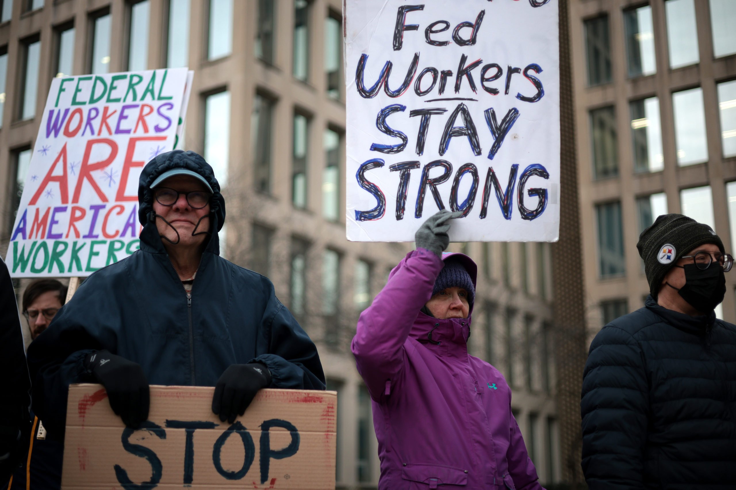 Protesters rally outside of the Theodore Roosevelt Federal Building headquarters of the U.S. Office of Personnel Management on February 05, 2025 in Washington, DC. (Photo by Alex Wong/Getty Images)