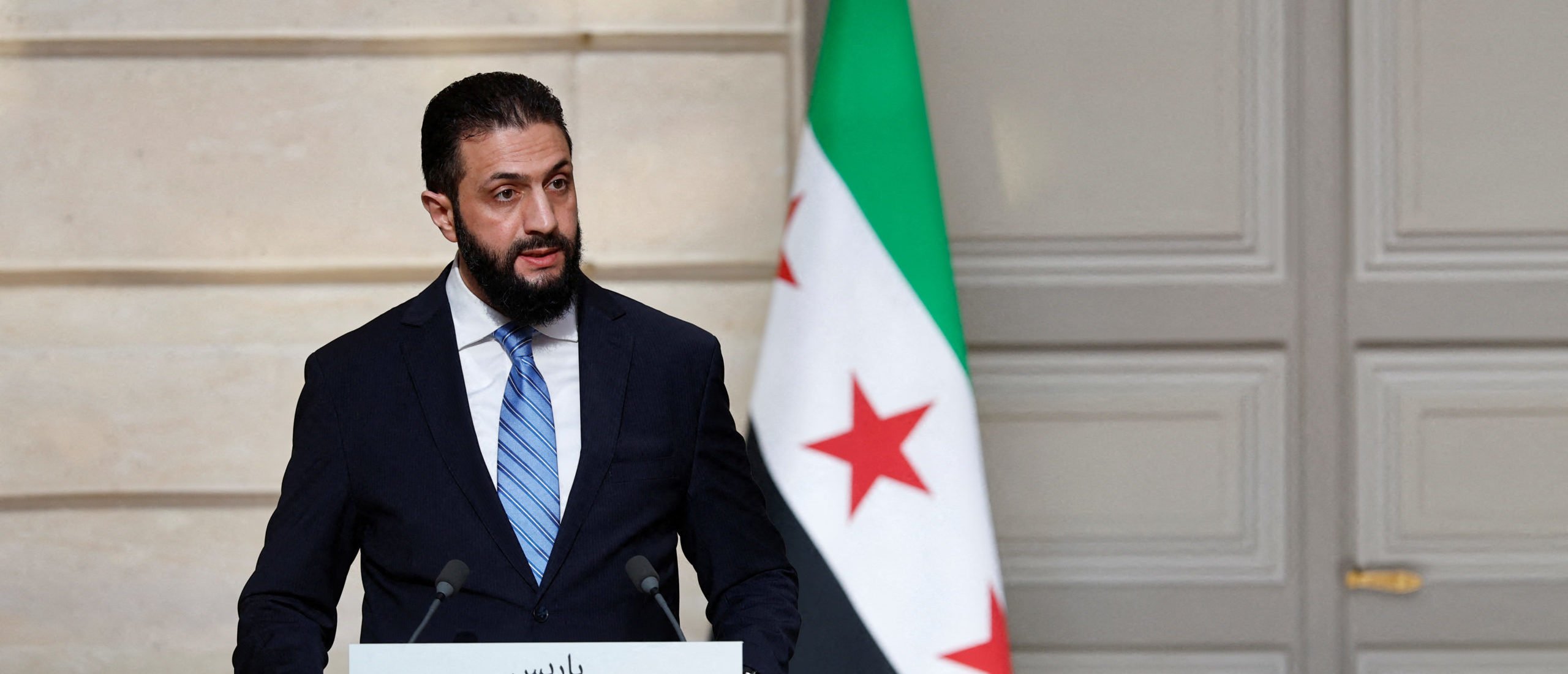 Syrian President Ahmed al-Sharaa speaks during a joint press conference with French President after a meeting at the Elysee Palace in Paris, on May 7, 2025. Syrian interim President Ahmed al-Sharaa arrived in Paris on May 7, state media reported, on his first visit to Europe since overthrowing longtime ruler Bashar al-Assad in December. (Photo by STEPHANIE LECOCQ/POOL/AFP via Getty Images)