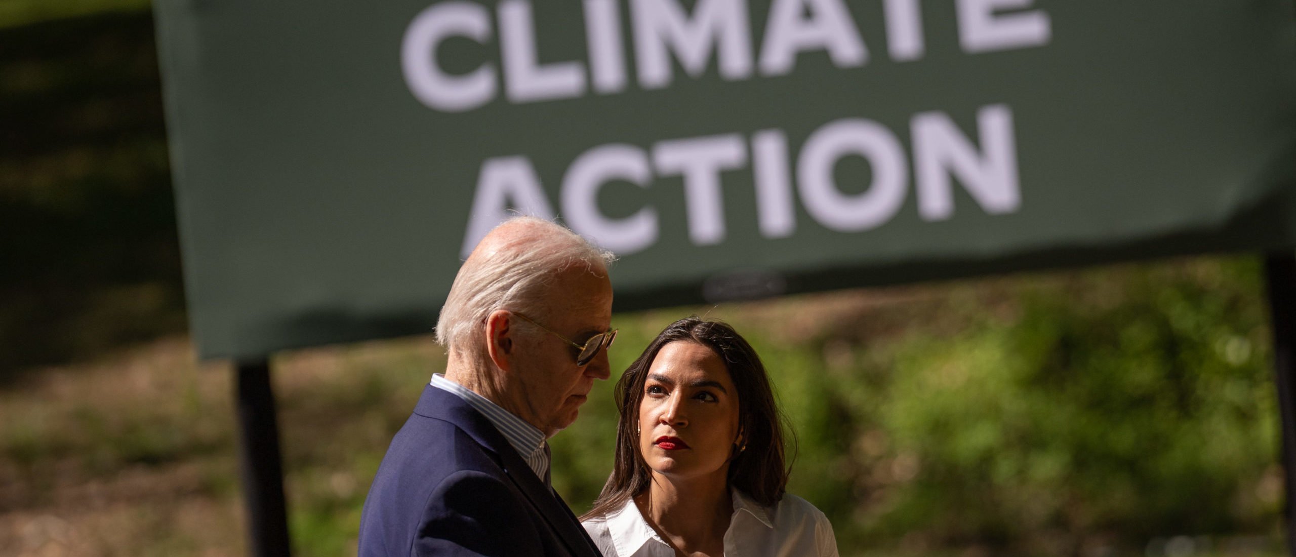 U.S. President Joe Biden speak with Rep. Alexandria Ocasio-Cortez (D-NY) following a speech at Prince William Forest Park on April 22, 2024 in Triangle, Virginia. (Photo by Andrew Harnik/Getty Images)