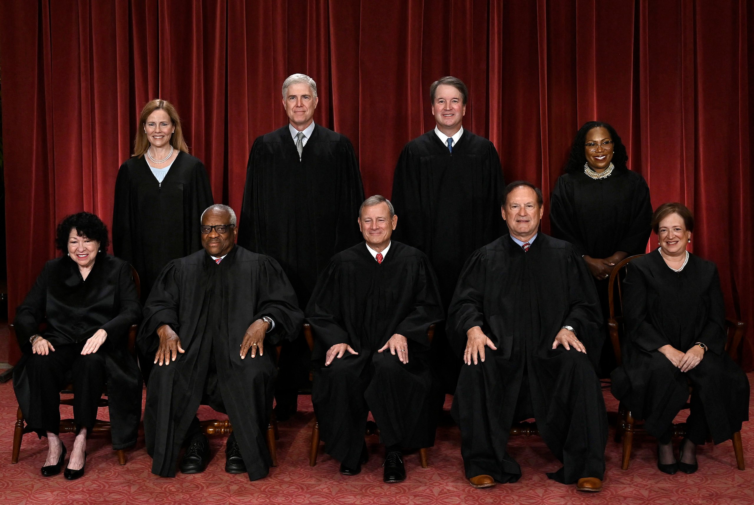 TOPSHOT - Justices of the US Supreme Court pose for their official photo at the Supreme Court in Washington, DC on October 7, 2022. (Seated from left) Associate Justice Sonia Sotomayor, Associate Justice Clarence Thomas, Chief Justice John Roberts, Associate Justice Samuel Alito and Associate Justice Elena Kagan, (Standing behind from left) Associate Justice Amy Coney Barrett, Associate Justice Neil Gorsuch, Associate Justice Brett Kavanaugh and Associate Justice Ketanji Brown Jackson. (Photo by OLIVIER DOULIERY / AFP) (Photo by OLIVIER DOULIERY/AFP via Getty Images)