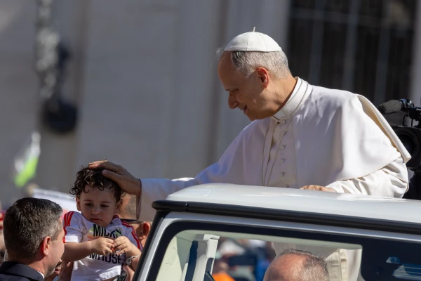Pope Leo XIV blesses a child from his popemobile on St. Peter's Square on Sunday, June 1, 2025. Credit: Daniel Ibáñez/CNA