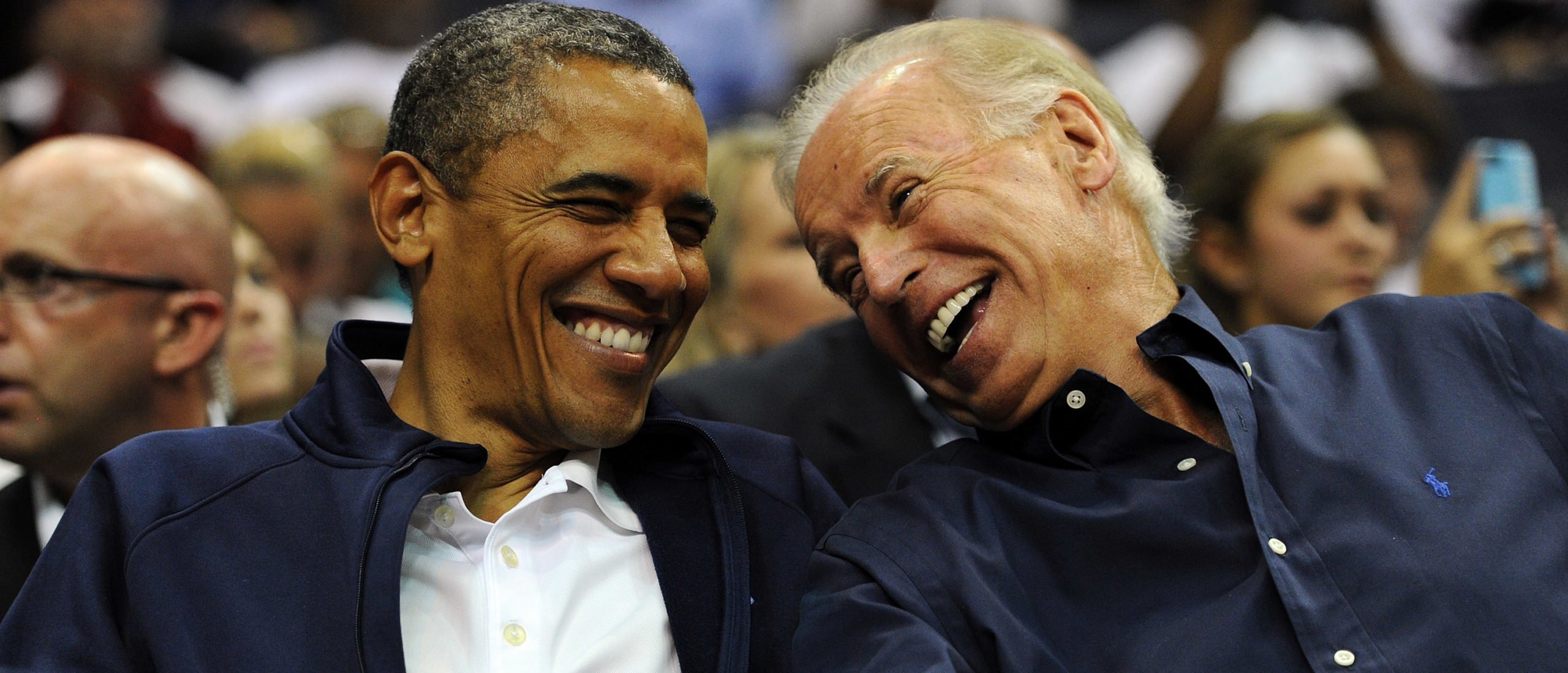 U.S. President Barack Obama and Vice President Joe Biden share a laugh as the US Senior Men's National Team and Brazil play during a pre-Olympic exhibition basketball game at the Verizon Center on July 16, 2012 in Washington, DC. (Photo by Patrick Smith via Getty Images)