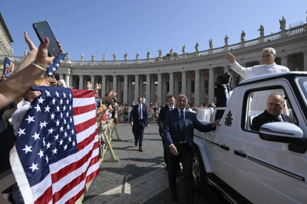 Pope Leo XIV waves as the popemobile passes by a crowd of American pilgrims gathered in St. Peter’s Square for the pope’s general audience on June 18, 2025, at the Vatican. Credit: Vatican Media