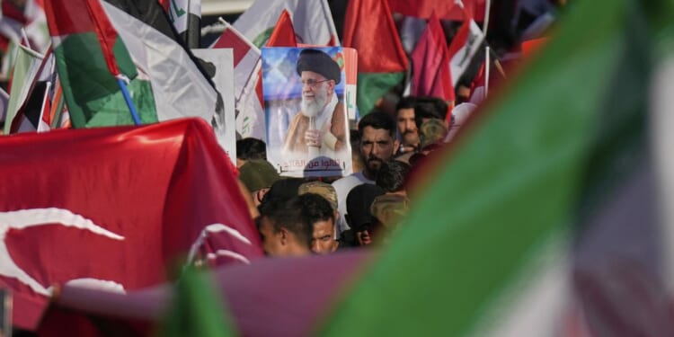 Revolutionary Guard of Iran accused of abducting journalist's family in retaliation for war coverage