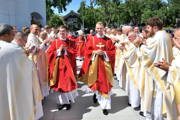 Father Ryan Martiré (center right) of the Bismarck Diocese, a Life-Giving Wounds alumnus, processes with Father Eric Artz after their ordination on June 11, 2024. Credit: Photo courtesy of Deacon Joe Krupinsky