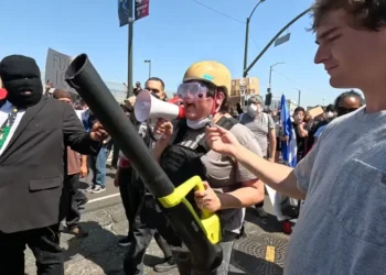 Anti-ICE Protester Hilariously Roasted Over Her Homemade Tactical Suit, Including Leaf Blower [WATCH]