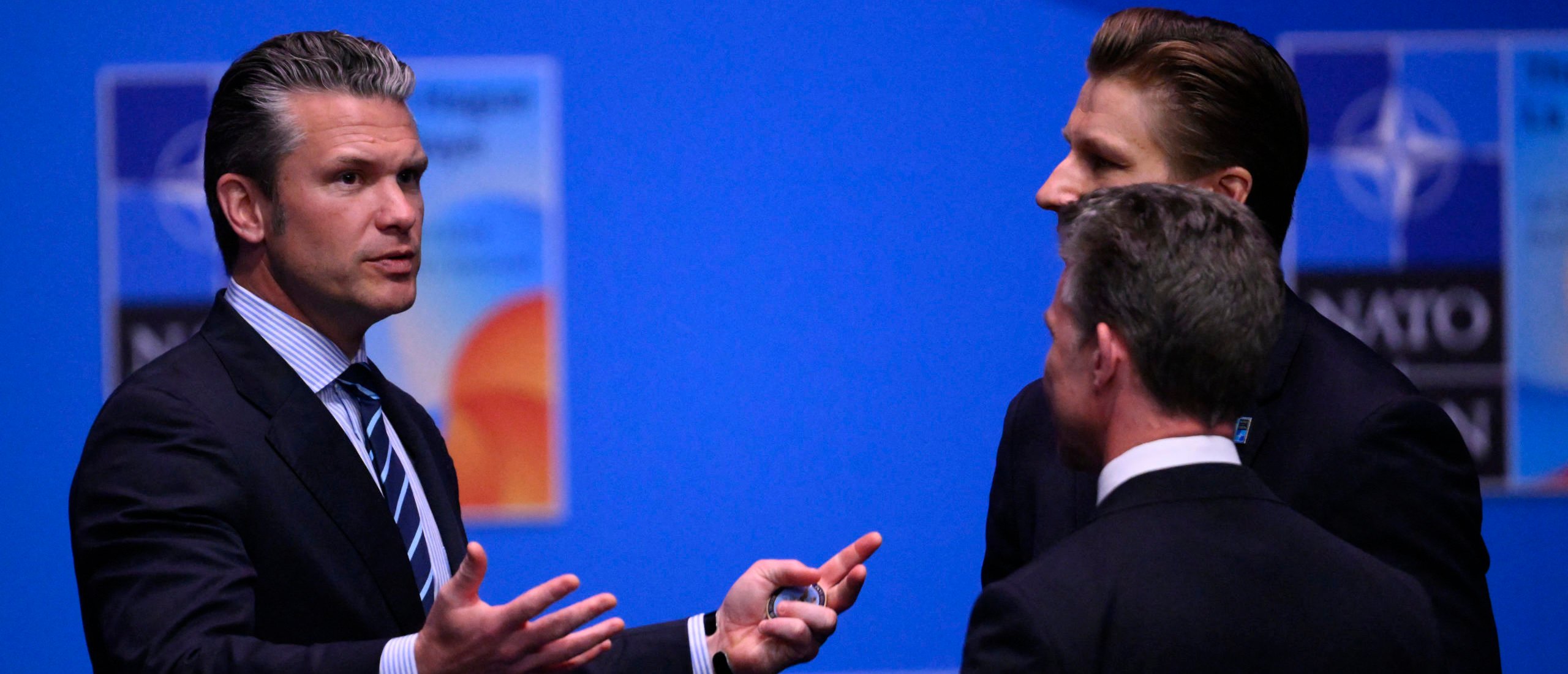 US Defence Secretary Pete Hegseth (L) gestures before a plenary session of the North Atlantic Treaty Organization (NATO) Heads of State and Government summit in The Hague, on June 25, 2025. NATO leaders hold a two-day summit on June 24 and 25 in The Hague. (Photo by JOHN THYS/AFP via Getty Images)