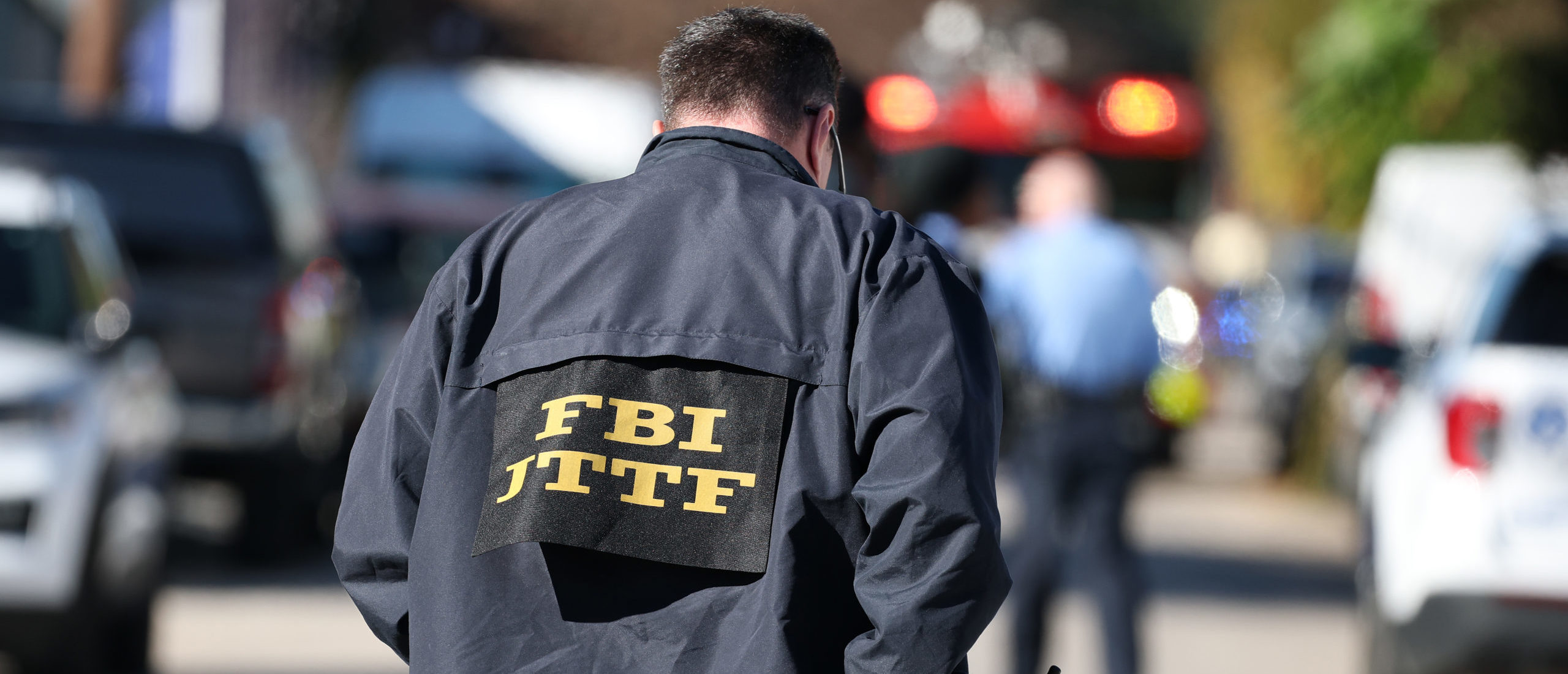 FBI agent on the scene outside a house fire on Mandeville Street that may be connected to the mass casualty Bourbon Street attack where at least ten people were killed when a person allegedly drove into the crowd in the early morning hours of New Year's Day on January 1, 2025 in New Orleans, Louisiana. Dozens more were injured after a suspect in a rented pickup truck allegedly drove around barricades and through a crowd of New Year's revelers on Bourbon Street. The suspect then got out of the car, opened fire on police officers, and was subsequently killed by law enforcement. (Photo by Chris Graythen/Getty Images)