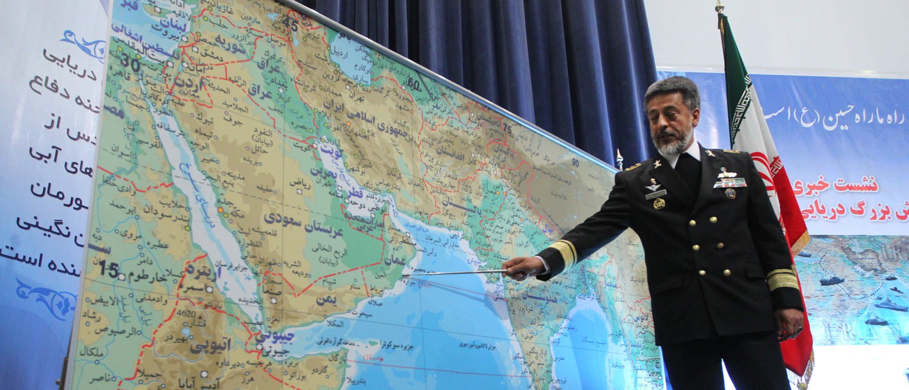 Iran's Navy Commander Admiral Habibollah Sayari points at a map during a press conference in Tehran on December 22, 2010. (Photo credit should read Hamed Jafarnejad/AFP via Getty Images)