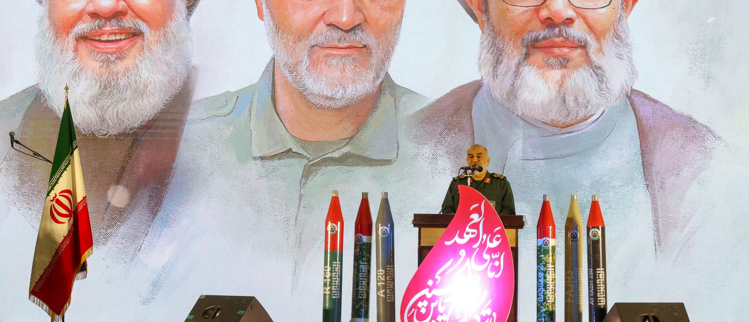 RGC commander-in-chief Major General Hossein Salami speaks during a memorial service beneath portraits of slain Hezbollah leader Hasssan Nasrallah (L) Iranian general Qassem Soleimani (C), and Nasrallah's successor Hashem Safieddine at Tehran's Grand Mosque in Iran's capital Tehran on February 23, 2025. Iran's supreme leader Ayatollah Ali Khamenei vowed "resistance" against Israel as Tehran-backed Hezbollah held a funeral on February 23 in Beirut for Nasrallah, killed in an Israeli strike last year. (Photo by ATTA KENARE/AFP via Getty Images)