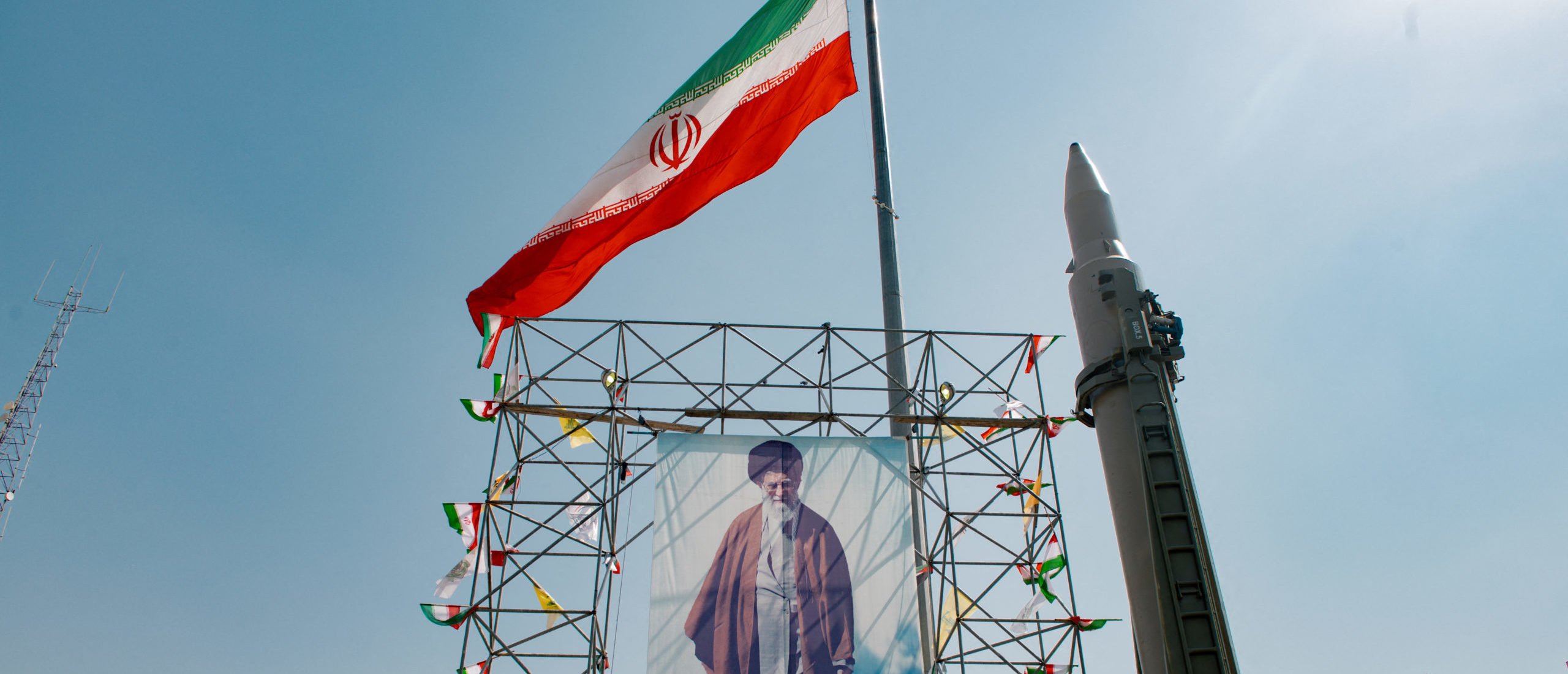 A big banner depicting Iran's Supreme Leader Ayatollah Ali Khamenei is placed next to a ballistic missile in Baharestan Square in Tehran, Iran, on September 26, 2024 on the sideline of an exhibition which marks the 44th anniversary of the start of Iran-Iraq war. (Photo by HOSSEIN BERIS/Middle East Images/AFP via Getty Images)