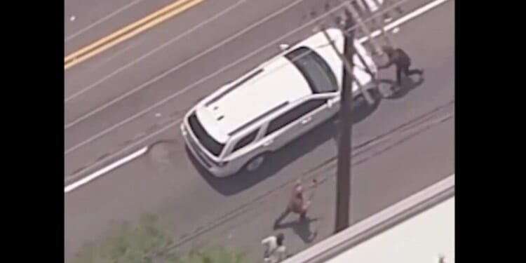 Tough guy tries to stop ICE raid SUV with his bare hands – and we get to watch smashing video!