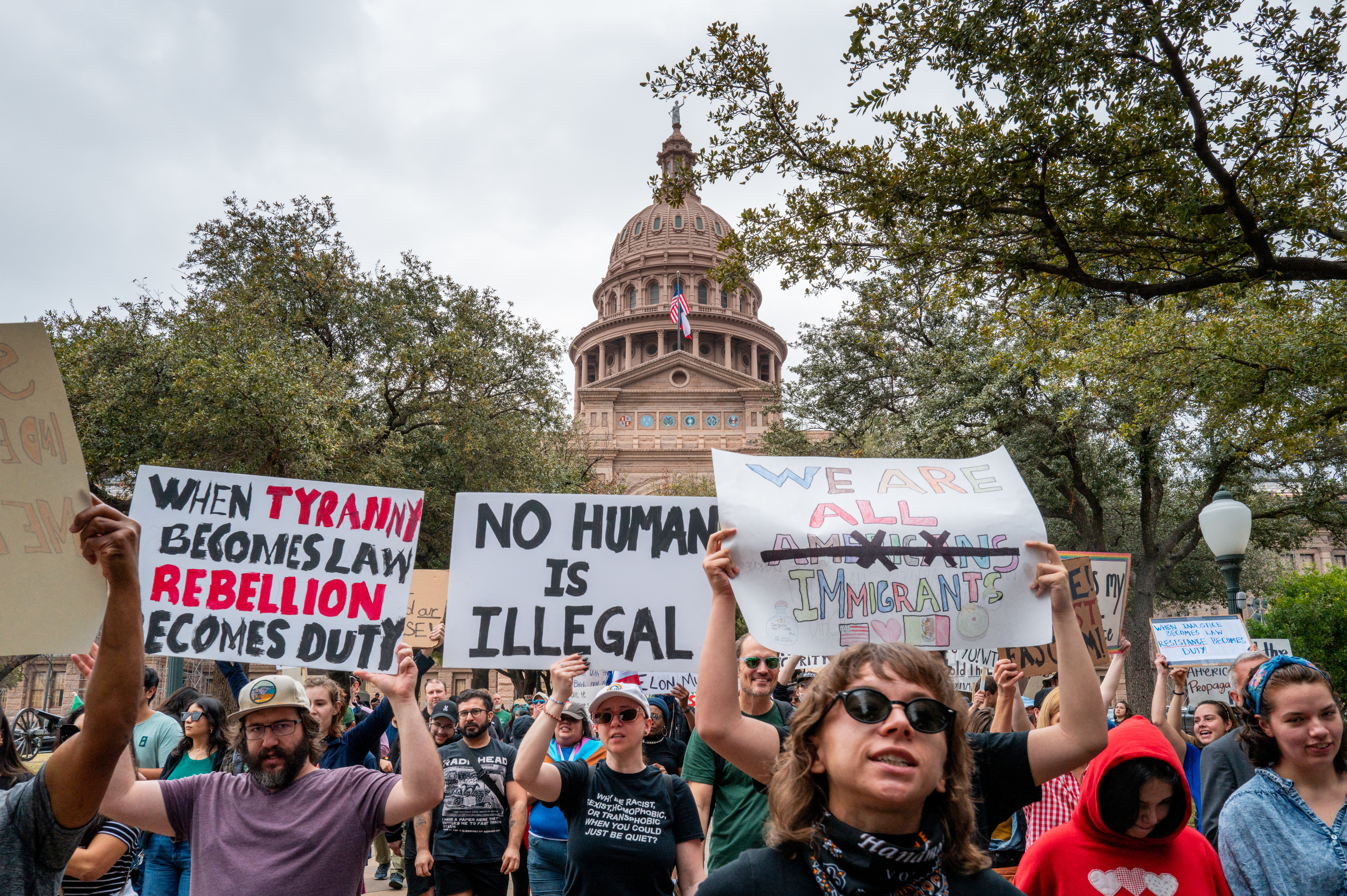AUSTIN, TEXAS - FEBRUARY 05: People prepare to march while protesting against U.S. President Donald Trump during a demonstration at the Texas State Capitol on February 05, 2025 in Austin, Texas. People all over the country rallied at their state capitols during a day of protest against U.S. President Donald Trump and the political initiative Project 2025. Demonstrators spoke out against the Trump administration and various newly introduced policies involving, immigration, the removal of diversity initiatives, and the potential accessing of private information involving Elon Musk's DOGE program. (Photo by Brandon Bell/Getty Images)