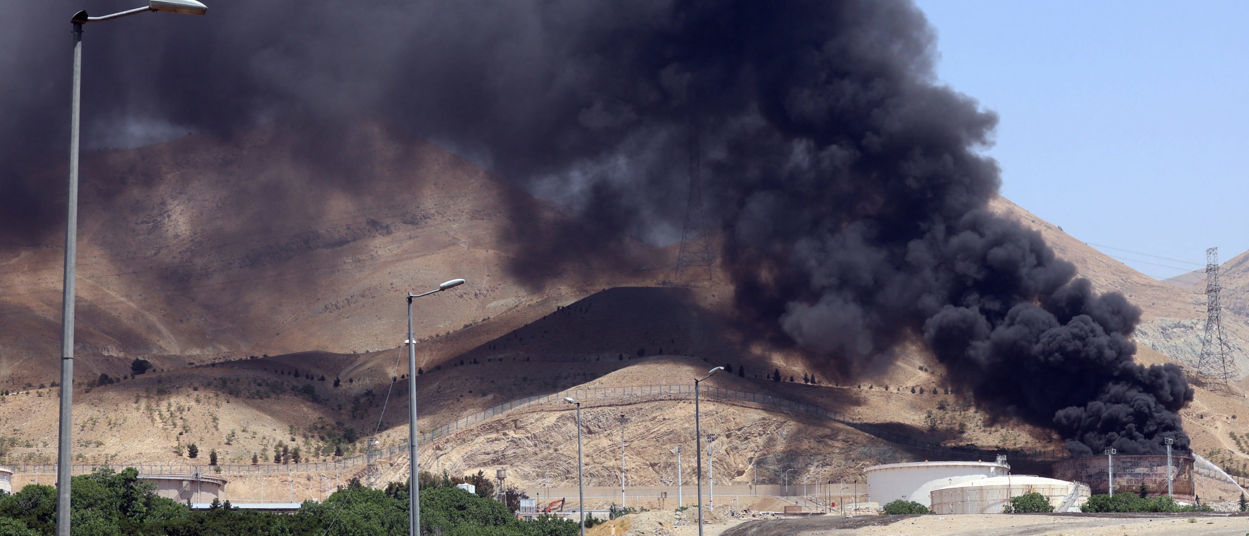 Smoke billows for the second day from the Shahran oil depot, northwest of Tehran, on June 16, 2025. Iran unleashed a barrage of missile strikes on Israeli cities early on June 16, after Israel struck military targets deep inside Iran, with both sides threatening further devastation. (Photo by -/AFP via Getty Images)