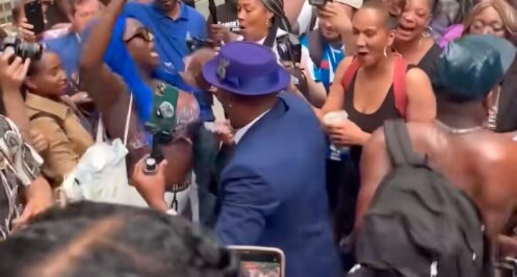 Diddy Fans Celebrate Verdict by Breaking Out Baby Oil Outside Courthouse – Glistening Nip Slip! [WATCH]