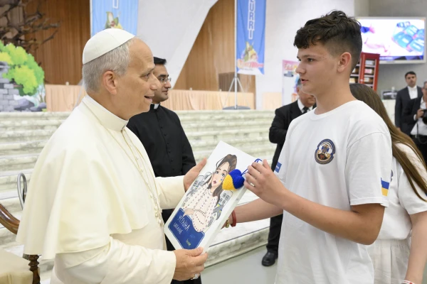 Pope Leo XIV receives a drawing from a participant in the “Estate Ragazzi in Vatican” summer camp on July 3, 2025, at the Vatican. Credit: Vatican Media