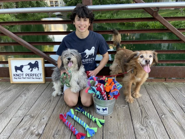 Austin Baron pictured with the handmade knotted dog toys given to people who have donated to Knot Perfect. Credit: Photo courtesy of Austin Baron