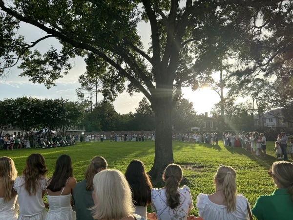 Camp Mystic alumnae and family sing after the memorial service on July 7, 2025, honoring victims of the flash floods in Central Texas last week. Credit: Amira Abuzeid/CNA