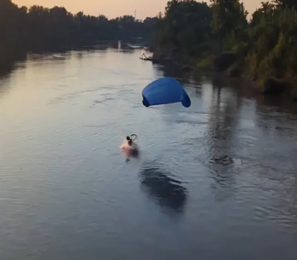 On-Lookers Horrified as North Dakota Paraglider Hits Power Line Plummeting Into River [WATCH]