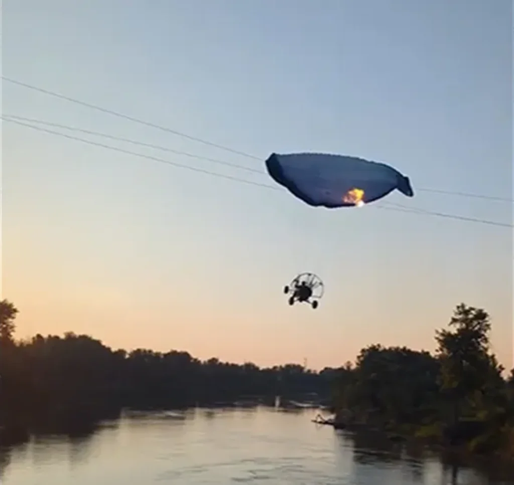 On-Lookers Horrified as North Dakota Paraglider Hits Power Line Plummeting Into River [WATCH]