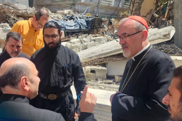 The Latin Patriarch of Jerusalem, Cardinal Pierbattista Pizzaballa is seen here speaking with Father Gabriel Romanelli, pastor of Holy Family Church, during his December 2024 visit to Gaza. Credit: Latin Patriarchate of Jerusalem