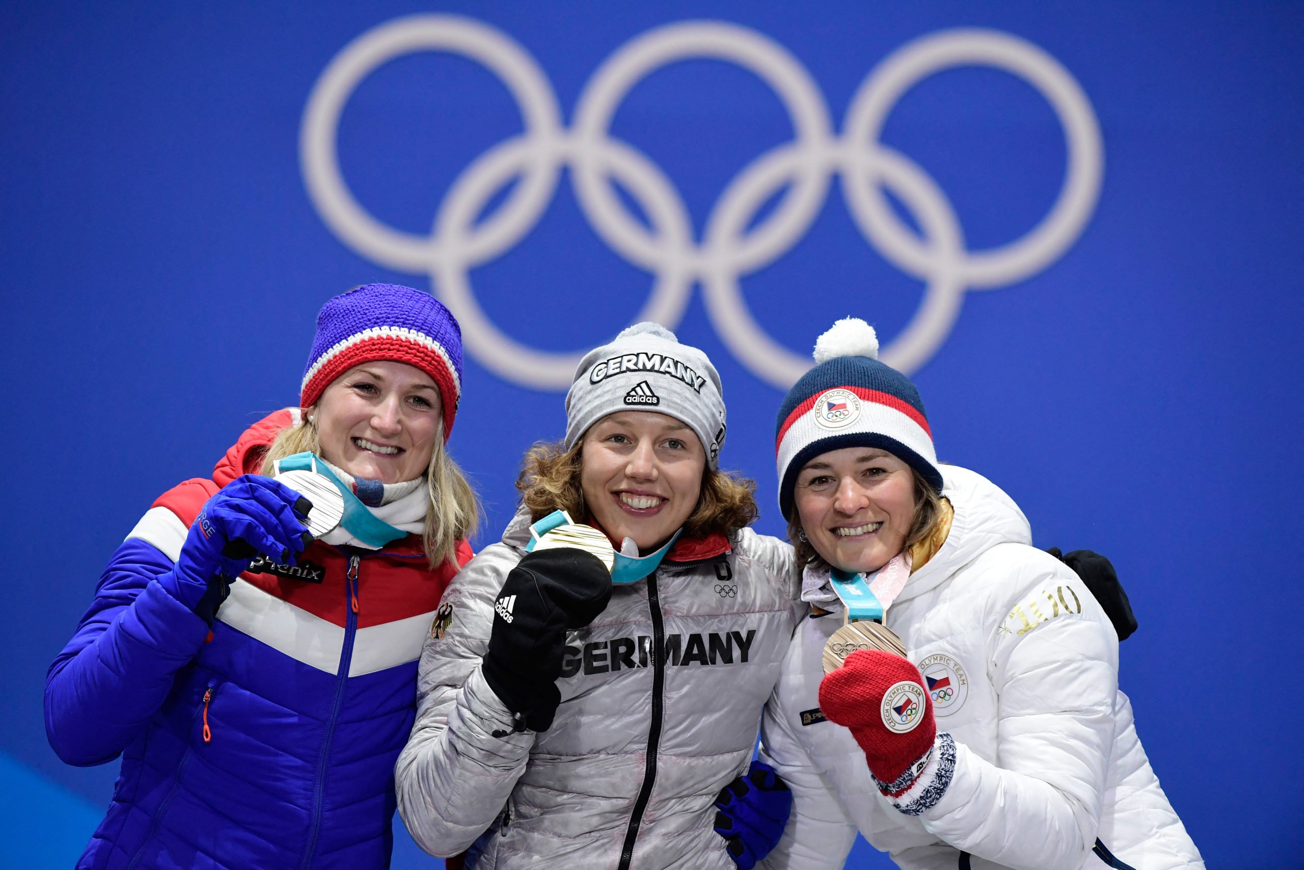 (L-R) Norway's silver medallist Marte Olsbu, Germany's gold medallist Laura Dahlmeier and Czech Republic's bronze medallist Veronika Vitkova pose on the podium during the medal ceremony for the biathlon Women's 7.5km Sprint at the Pyeongchang Medals Plaza during the Pyeongchang 2018 Winter Olympic Games in Pyeongchang on February 11, 2018. (Photo by JAVIER SORIANO / AFP) (Photo by JAVIER SORIANO/AFP via Getty Images)