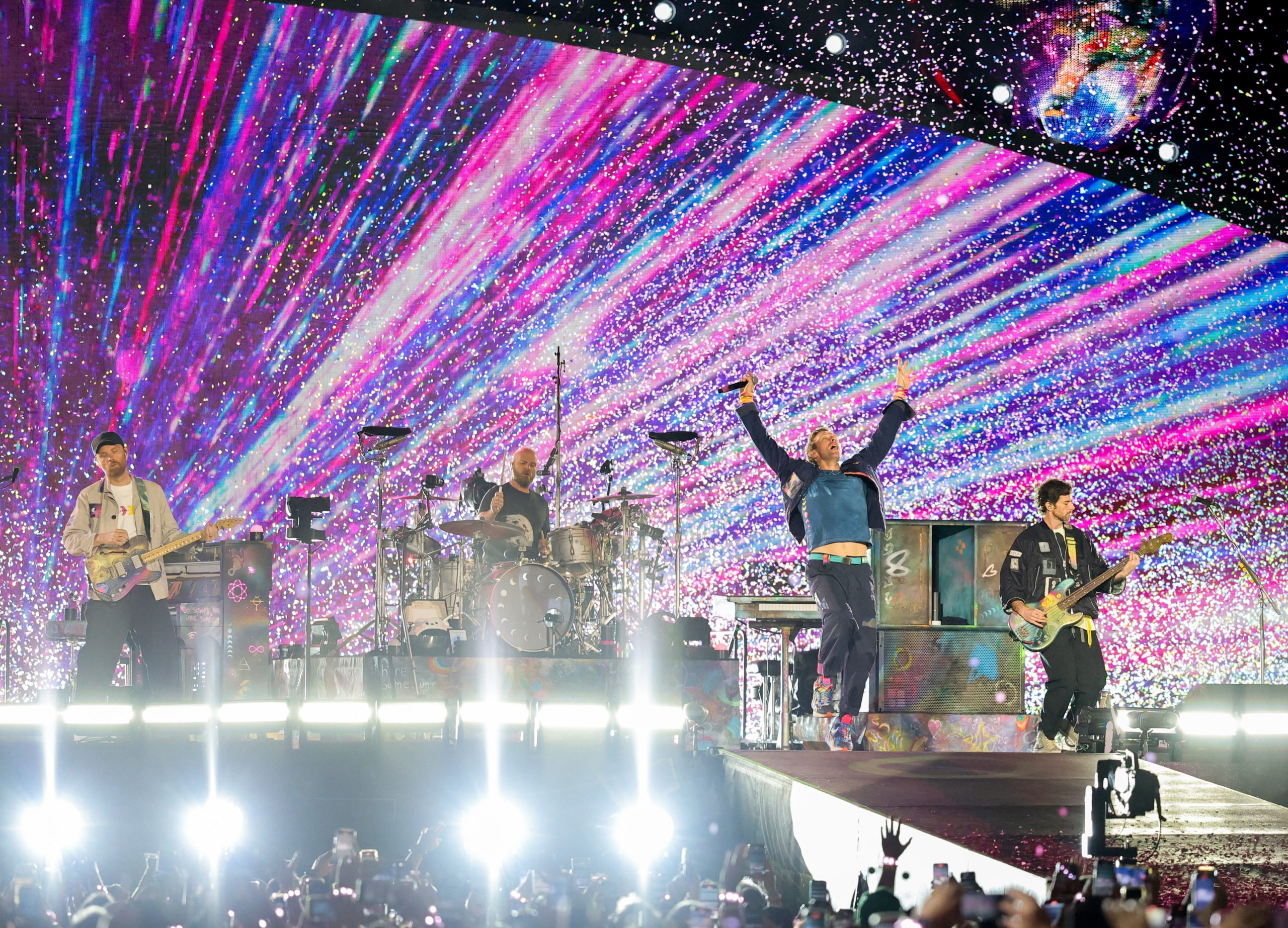 LAS VEGAS, NEVADA - JUNE 06: (L-R) Jonny Buckland, Will Champion, Chris Martin and Guy Berryman of Coldplay perform on a stop of the band's Music of the Spheres world tour at Allegiant Stadium on June 06, 2025 in Las Vegas, Nevada. (Photo by Ethan Miller/Getty Images)