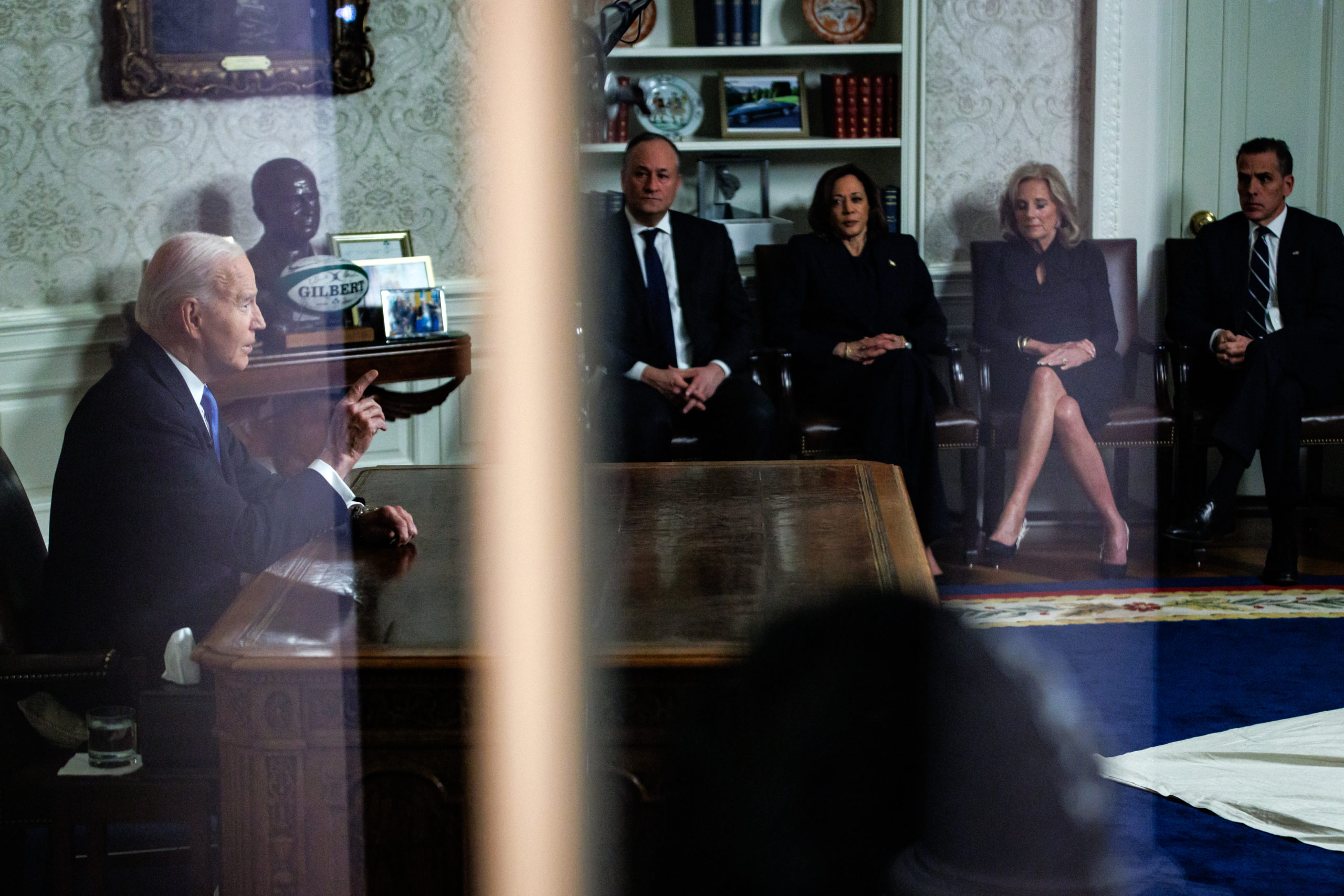 U.S. President Joe Biden delivers a farewell Address to the Nation from the Oval Office while (from left to right) U.S. Second Gentleman Doug Emhoff, U.S. Vice President Kamala Harris, U.S. First Lady Jill Biden, son Hunter Biden listen on at the White House on January 15, 2025 in Washington, DC. (Photo by Samuel Corum/Getty Images)