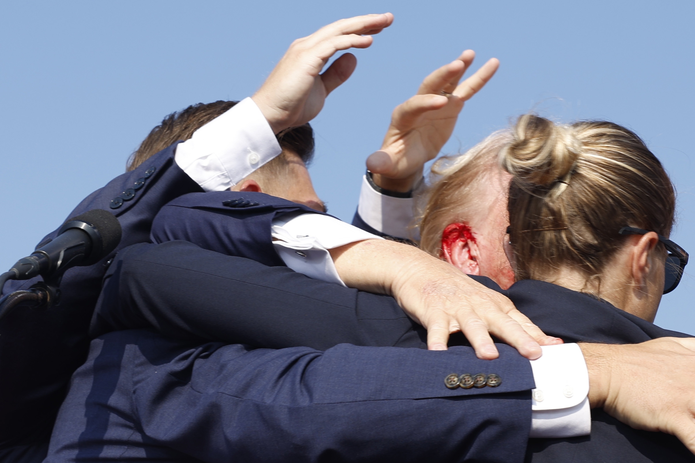 Republican presidential candidate former President Donald Trump is rushed offstage during a rally on July 13, 2024 in Butler, Pennsylvania. Butler County district attorney Richard Goldinger said the shooter is dead after injuring former U.S. President Donald Trump, killing one audience member and injuring another in the shooting. (Photo by Anna Moneymaker/Getty Images)