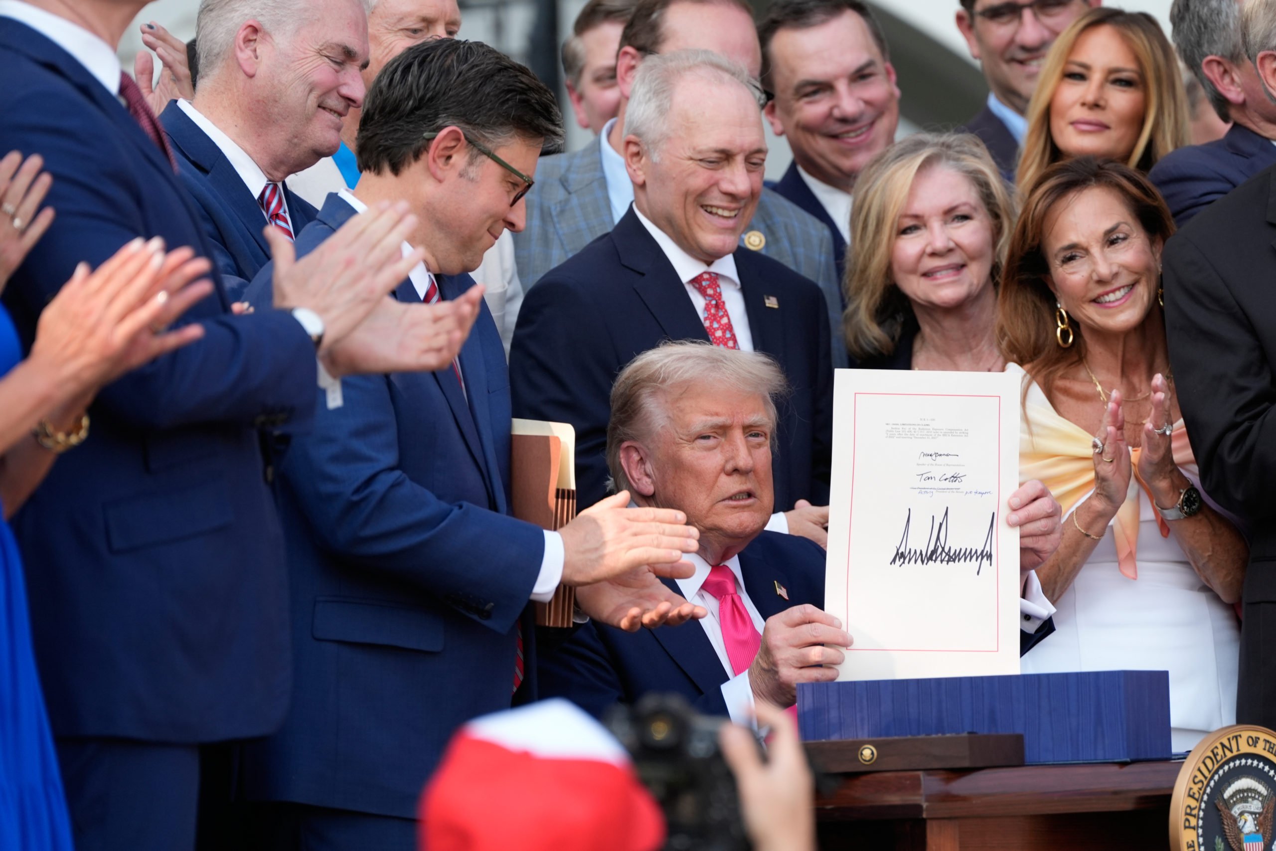 WASHINGTON, DC - JULY 04: President Donald Trump holds up the 