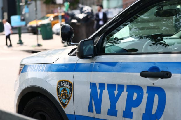 NEW YORK, NEW YORK - JUNE 02: NYPD officers stand guard outside of Chabad Lubavitch World Headquarters on June 02, 2025 in the Crown Heights neighborhood of the Brooklyn borough in New York City. The NYPD announced heightened security at Jewish religious sites on the first day of Shavuot, a holiday that began at sundown last night and runs through tomorrow evening. Yesterday eight people were hospitalized when a man attacked a gathering in support of hostages held in Gaza using a makeshift flamethrower. The incident is being treated as an act of terrorism. (Photo by Michael M. Santiago/Getty Images)