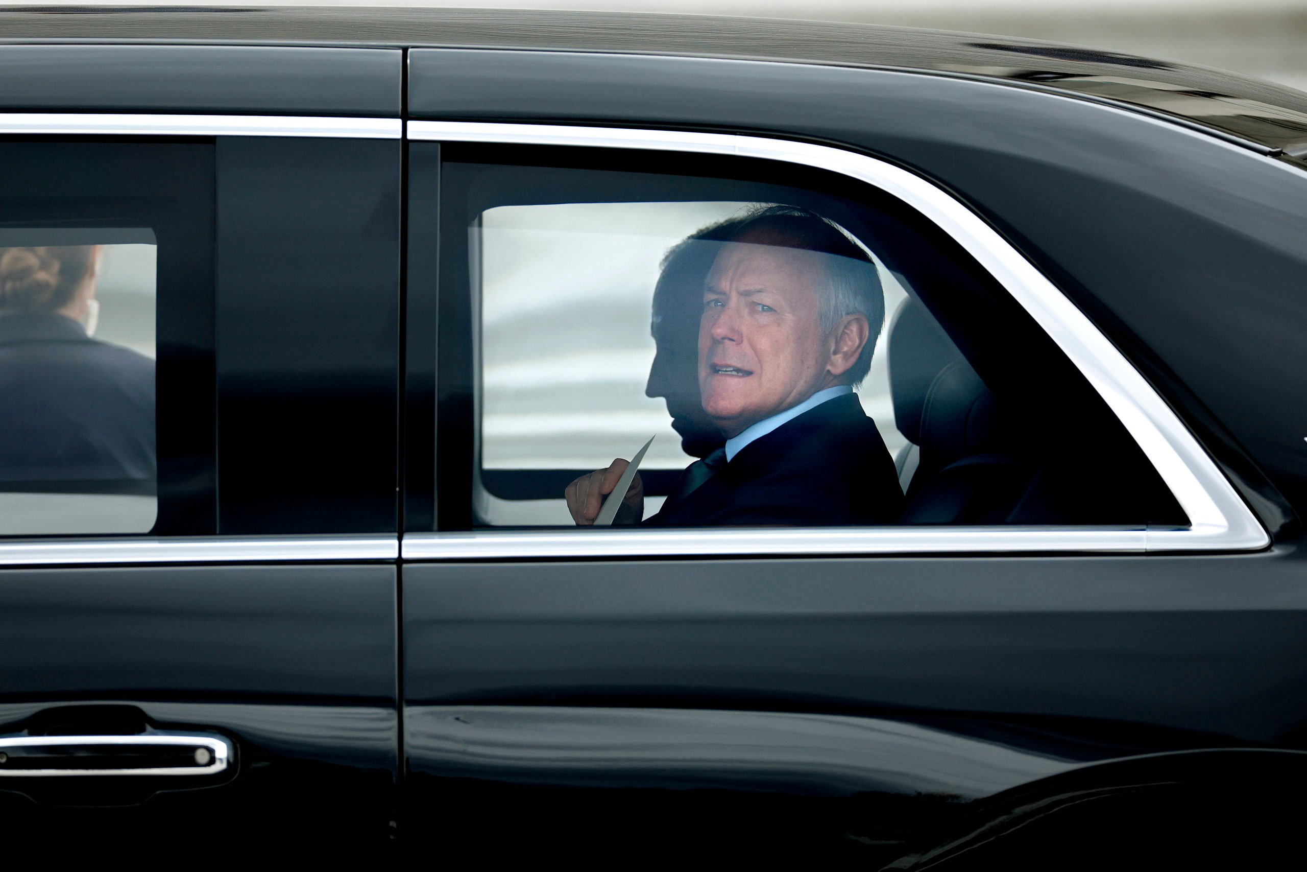 WASHINGTON, DC - MARCH 15: Counselor to the President Steve Ricchetti looks out of the presidential limousine as he and U.S. President Joe Biden depart the U.S. Capitol on March 15, 2023 in Washington, DC. Biden joined Irish Taoiseach Leo Varadkar and members of Congress for the traditional St. Patrick's Day Friends of Ireland luncheon. The Friends of Ireland caucus was founded in 1981 by the late Irish-American politicians Sen. Ted Kennedy (D-MA), Sen. Daniel Moynihan (D-NY) and former Speaker of the House Tip O’Neill (D-MA) to help broker peace and reconciliation in Northern Ireland. (Photo by Chip Somodevilla/Getty Images)