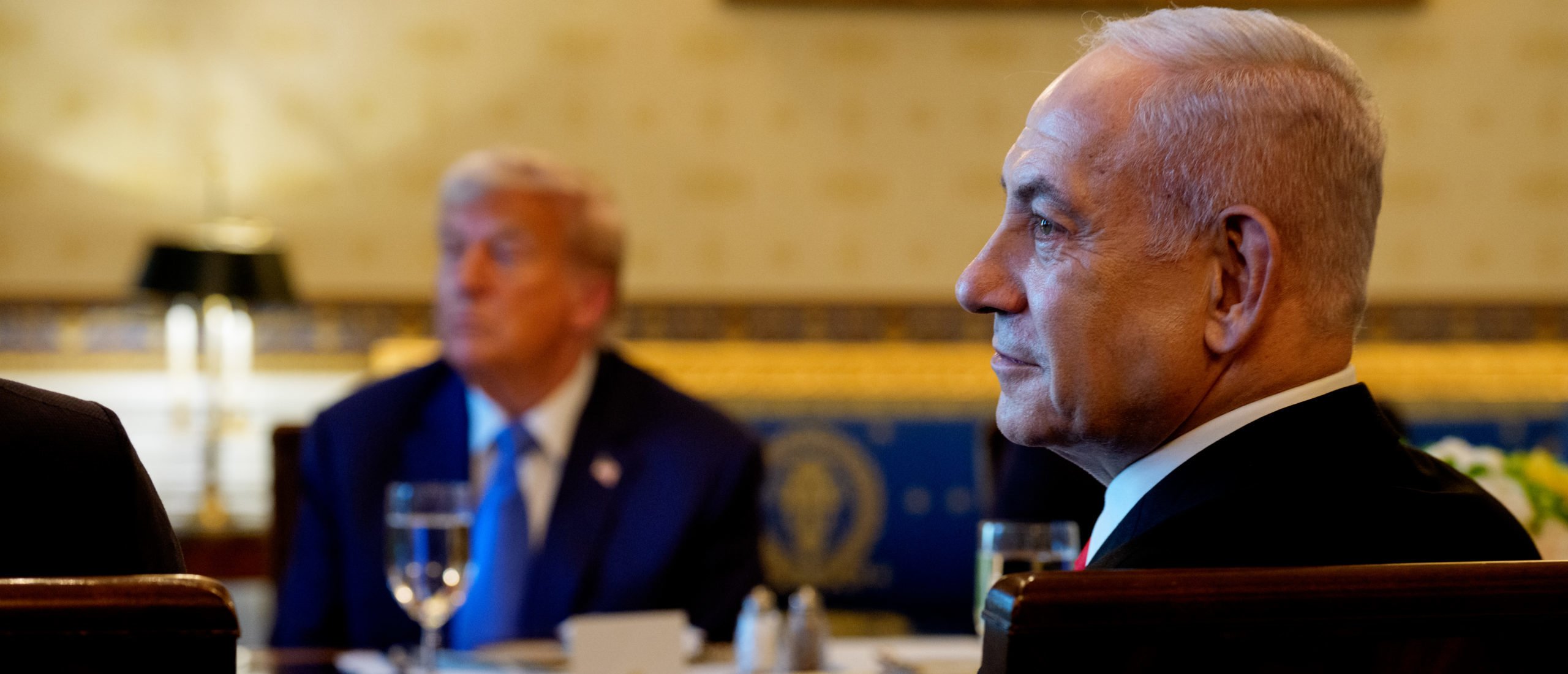 U.S. President Donald Trump (L) and Israeli Prime Minister Benjamin Netanyahu (R) attend a dinner in the Blue Room of the White House on July 07, 2025 in Washington, DC. Trump is hosting Netanyahu for a dinner as the two discuss a potential ceasefire agreement to end the fighting in Gaza. (Photo by Andrew Harnik/Getty Images)