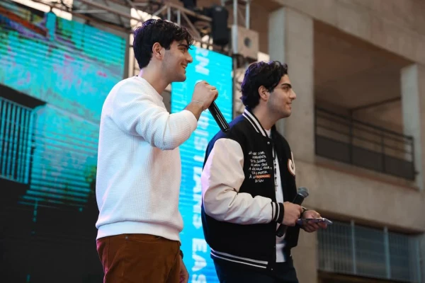 Charbel and Giovanni Lteif on stage at a Marian Family Sodality event in Lebanon, where youth from across Lebanon came together to pray, celebrate Jesus, and grow in faith. Credit: Photo courtesy of Charbel and Giovanni Lteif