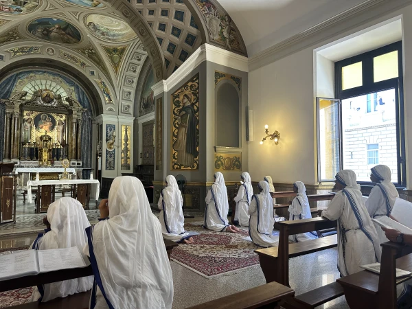 Missionaries of Charity kneel in prayer before the Blessed Sacrament in the chapel where they are inviting young people to come and prayer at the Jubilee of Youth. Courtney Mares