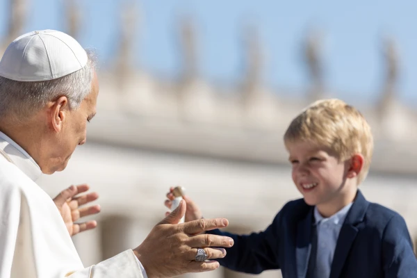 Pope Leo XIV receives a gift from during the Wednesday general audience on Aug. 6, 2025, in St. Peter’s Square at the Vatican. Credit: Daniel Ibañez/CNA