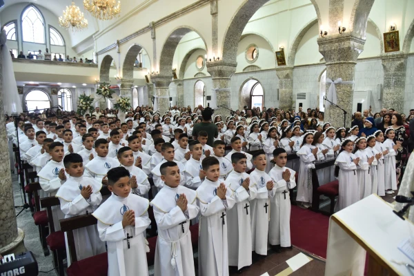 Children gather in St. Mary al-Tahir Church, also known as the Church of the Immaculate Conception, in Baghdad for their first Communion. Credit: Chaldean Catholic Church